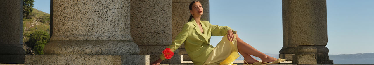a woman wearing yellow slingback