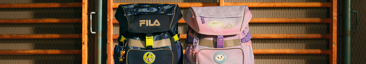 FILA backpacks displayed on classroom shelves.