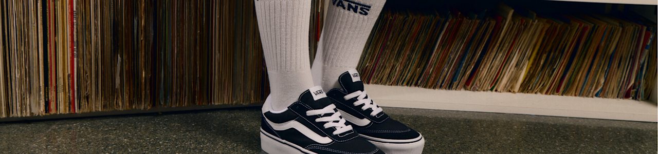 women wearing black sneakers