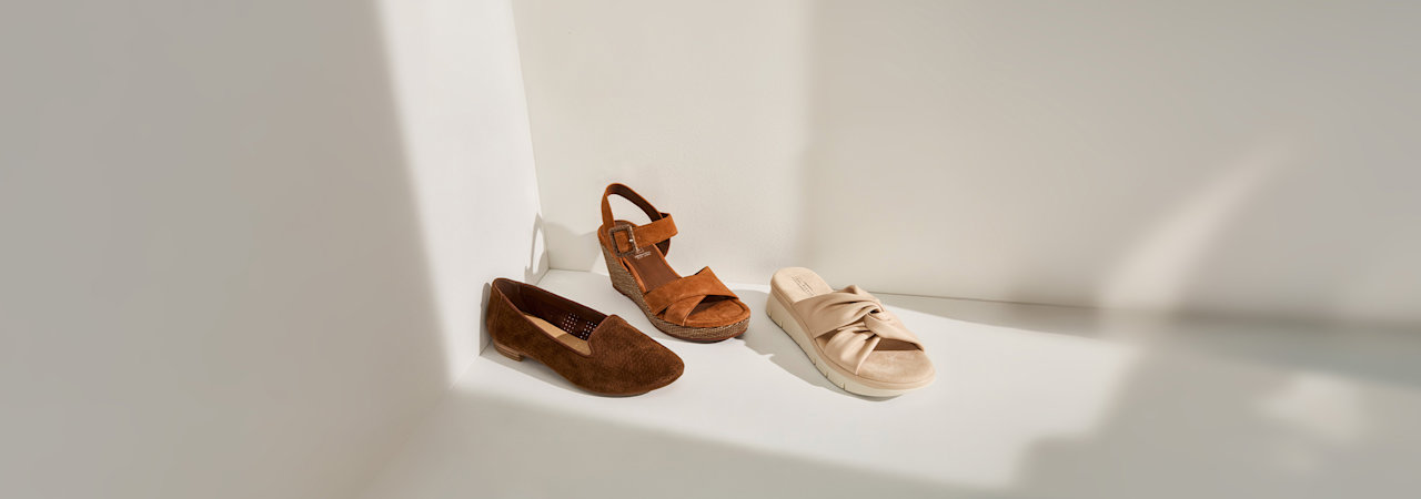 three different summer shoes on a wall