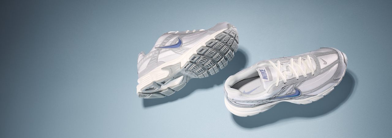 Two Sneaker in front of blue background