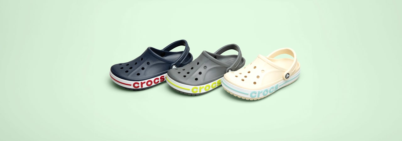 Crocs on green background
