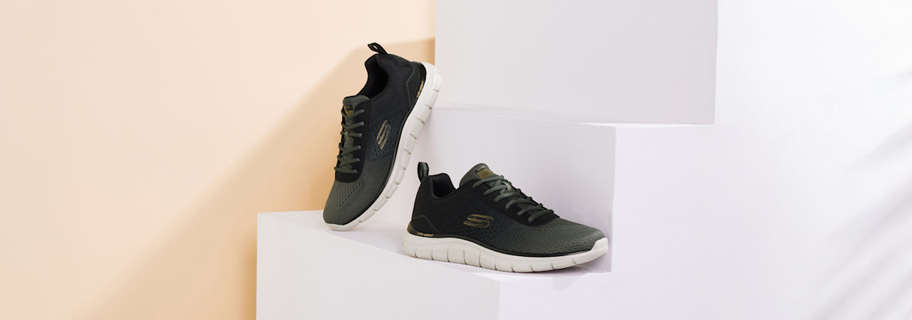 Two sneakers on white stairs