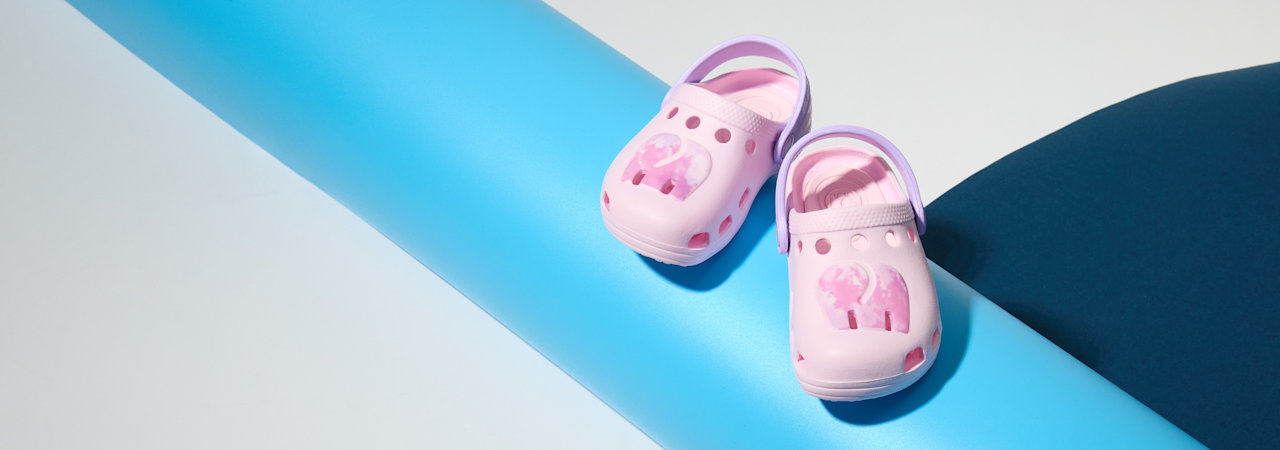 Two Shoes in front of a coloured background