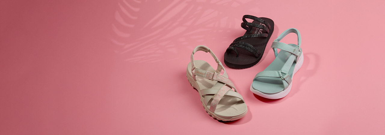 three Skechers sandals on a pink background