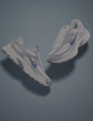 a pair of white, grey and bluew nike sneakers