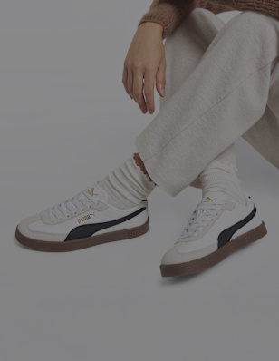 Womens legs with Puma sneaker