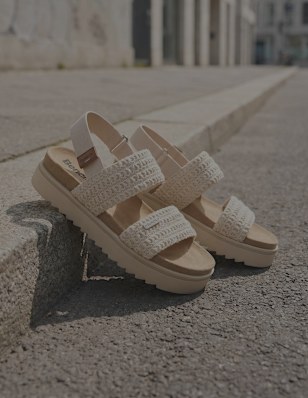 sandals at a curb