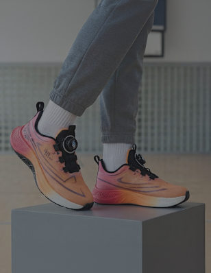 A kids sneaker on a pedastal