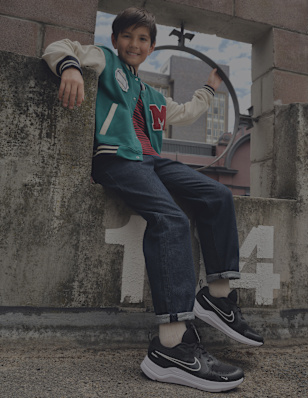 A boy wearing black sneaker