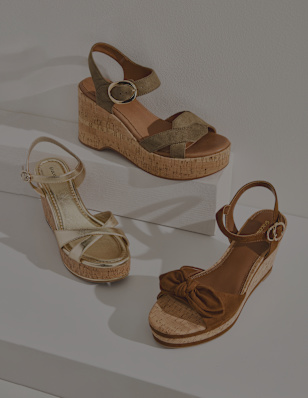 three different summer shoes on a podest