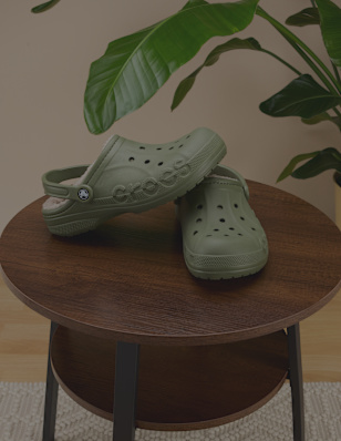 a pair of green crocs