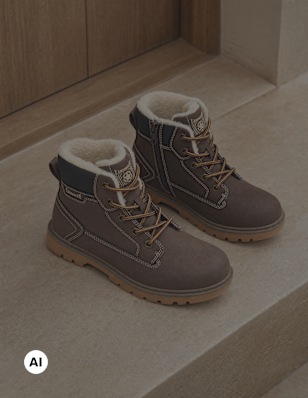 kids boots standing on stairs