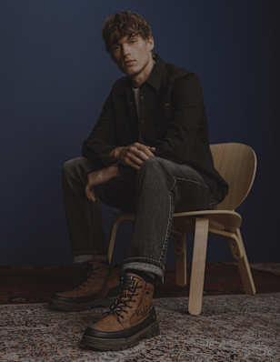 men sitting on a chair