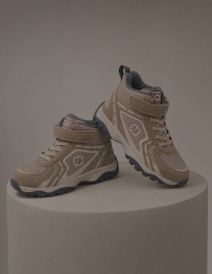 children boots standing on pedestal