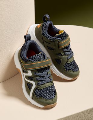 Kids sneakers on a pedestal