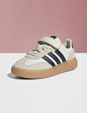 A kids sneaker on a pedastal