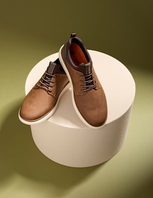 Two men shoes on a pedestal