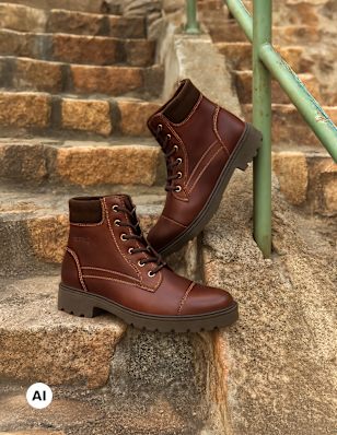 Two leather Lace-Up Boots on a stair