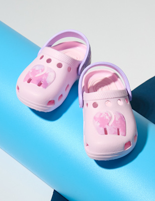 Two Shoes in front of a coloured background