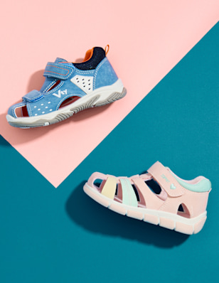 Kids sandals on multicolor background