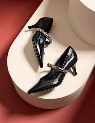 Women's heels on a beige pedestal