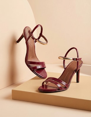 heeled sandals on a pedestal
