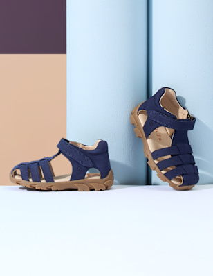 Kids sandals in front of 3d background