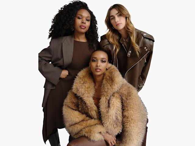 Three models in coordinated brown and tan fashion looks, including a faux-fur jacket, tailored outerwear, and leather pieces, posed against a plain background.