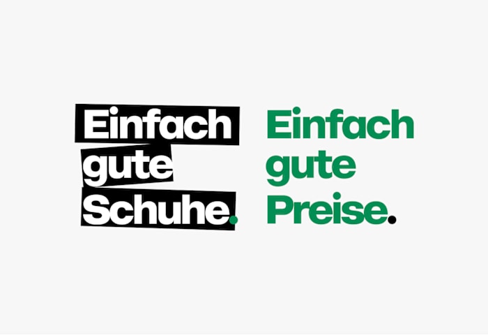 The image shows the text “Einfach gute Schuhe. Einfach gute Preise.” displayed on a white background. The first phrase is in bold white letters inside a black text box, and the second phrase is in green letters on the white background.