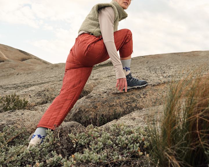 person climbing hills