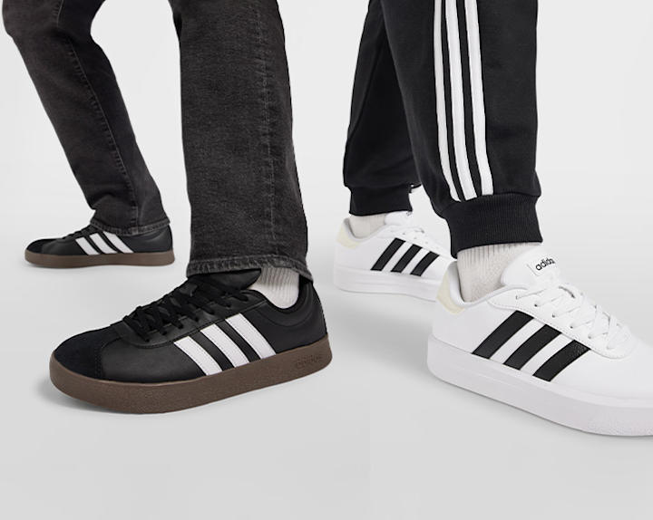 Black and white adidas sneakers on white background