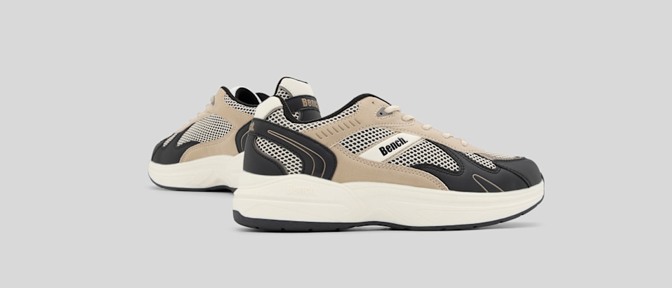 Grey background and a sneaker black and white