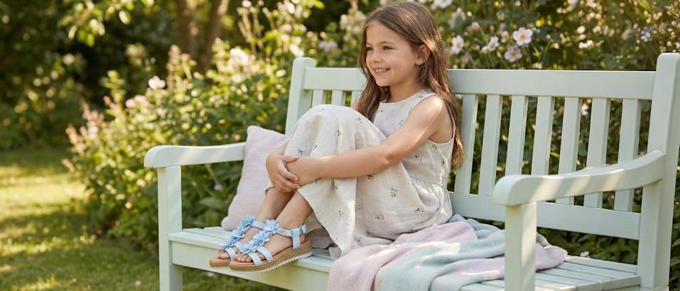 girl sitting on a bank