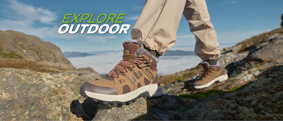 Explore Outdoor banner featuring brown hiking shoes on a rocky viewpoint.