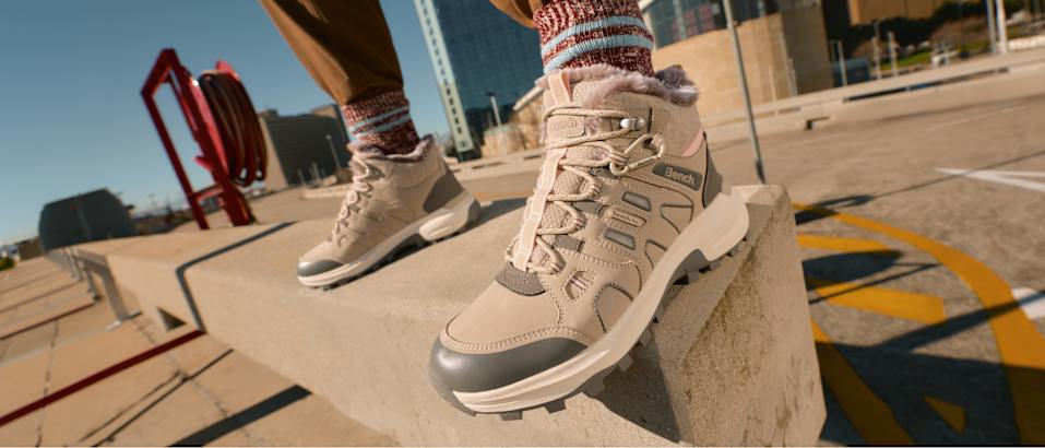 Explore Outdoor promotional image showing a light outdoor shoe in a city setting.