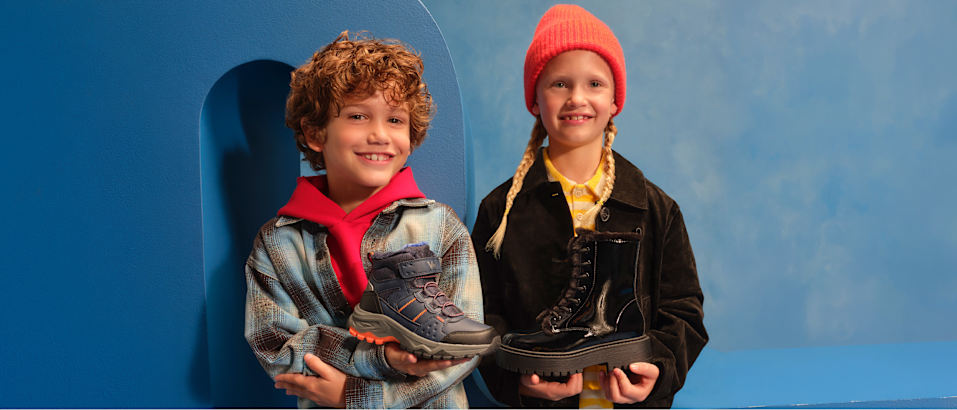 kids with boots in their hands on a blue background