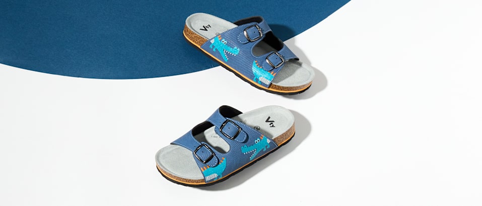 Two Shoes in front of a coloured background