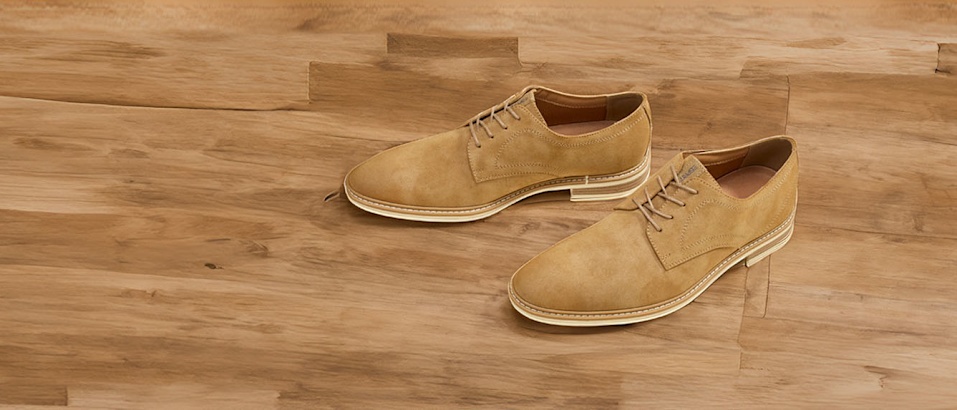 Brown leather shoes on parquet