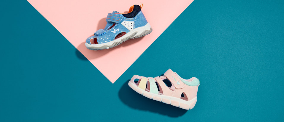 kids sandals on multicolor background